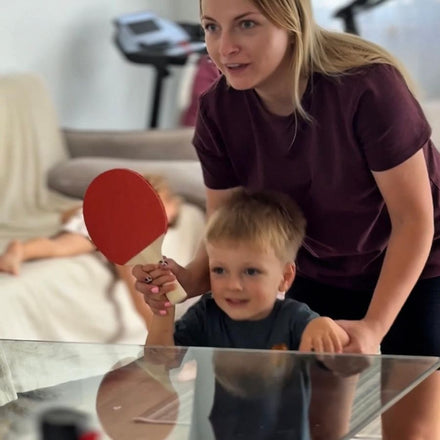 Family playing table tennis with the NetFlex net
