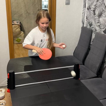Family playing table tennis with the NetFlex net